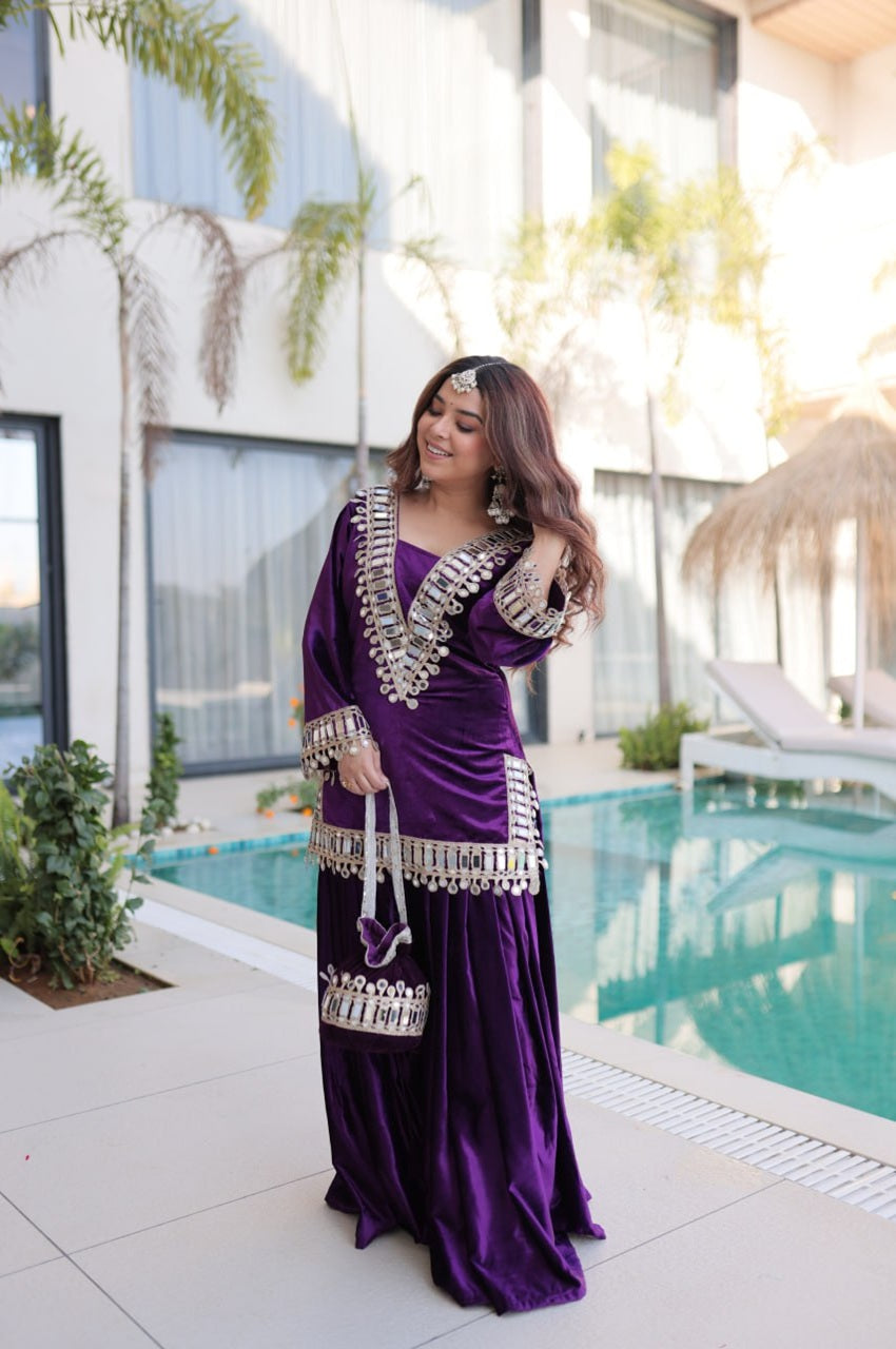 Woman in a purple traditional outfit standing by a pool with a modern building in the background