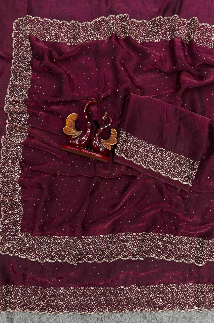 Close-up of a burgundy fabric with decorative trim on a gray background