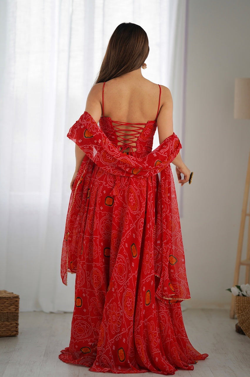 Red patterned dress worn by a person in a minimal indoor setting