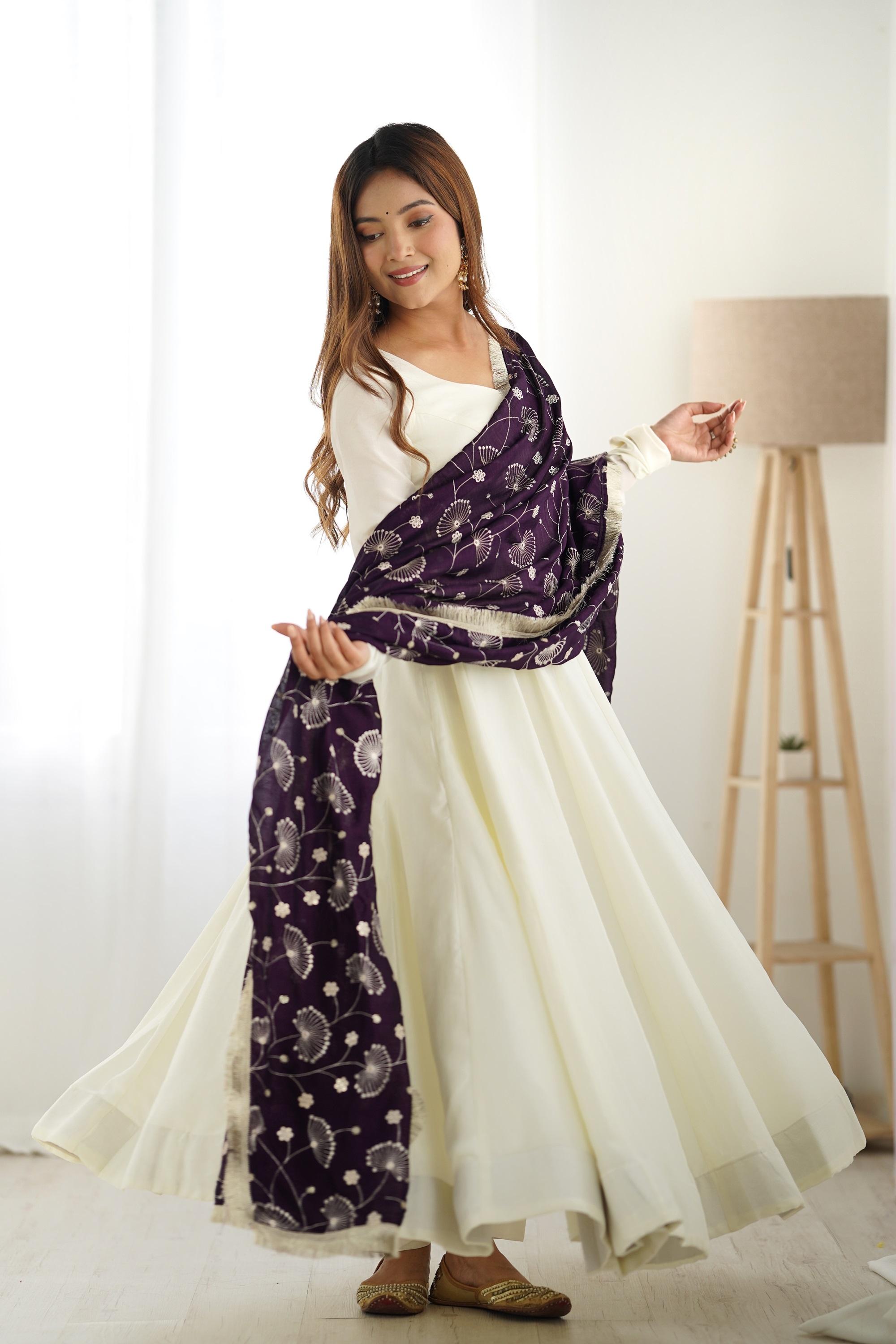 White Silk Anarkali Gown with Purple Heavy Embroidered Dupatta White Silk Anarkali Gown with Purple Heavy Embroidered Dupatta