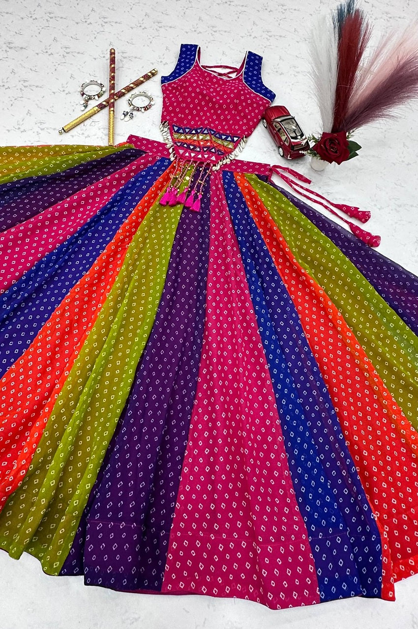 Colorful traditional outfit with a pink top and multicolored skirt on a white background