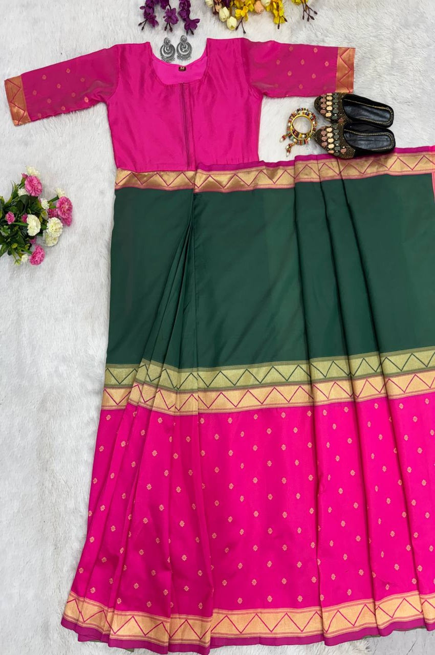 Green and pink traditional outfit with floral decorations on a white background